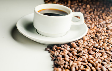 a cup of coffee, grains, books