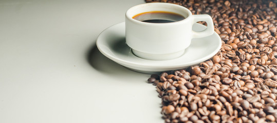 a cup of coffee, grains, books