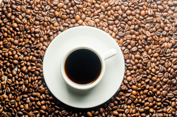 a cup of coffee, grains, books