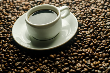 a cup of coffee, grains, books