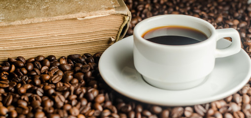 a cup of coffee, grains, books