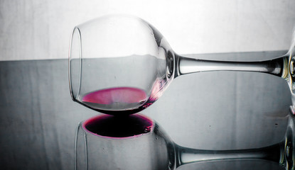 a glass of wine on a dark background