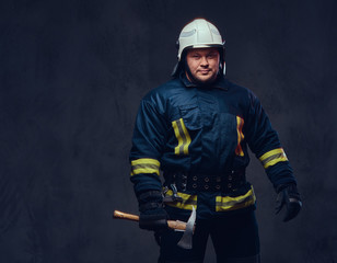 Fototapeta premium Firefighter holds the axe.