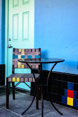 Colorful chair with table outside