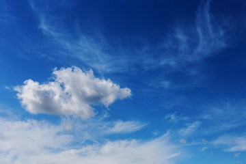 a beautiful blue sky day with white clouds as background