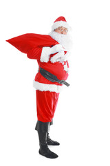 Real Santa Claus carrying big bag full of gifts, isolated on white background