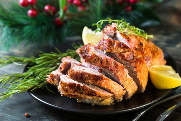 A large baked piece of meat. Festive ham