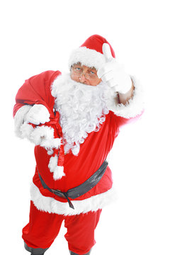 Real Santa Claus carrying big bag full of gifts, isolated on white background