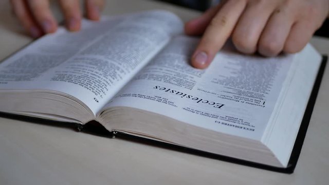 A man reading and studying the Holy Bible