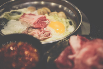 Cooking food in hot pot for make sukiyaki or shabu