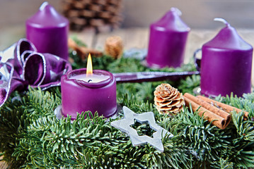 Christmas candlestick with burning candle