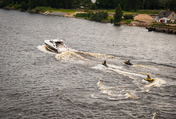 Motor bikes jumping on the waves