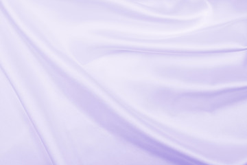 Smooth elegant lilac silk or satin texture as wedding background. Luxurious background design