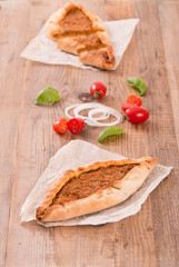 Turkish pide pizza with meat and onion. 
