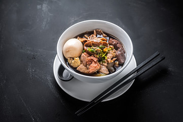 Paste of rice flour or Boiled Chinese pasta square, Chinese roll noodle soup.