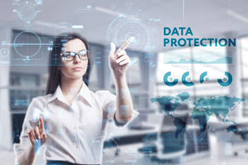 The concept of business, technology, the Internet and the network. A young entrepreneur working on a virtual screen of the future and sees the inscription: Data protection
