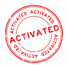 Grunge red activated rubber seal stamp on white background