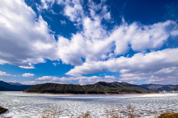 White snow-clad rivers and clouds.
