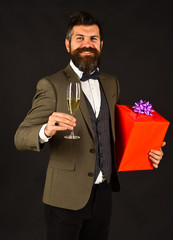 Businessman with happy face and red gift box.