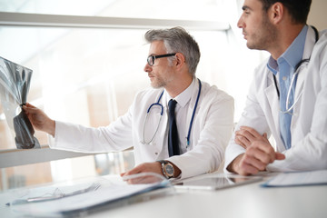 Doctors in office working on medical report