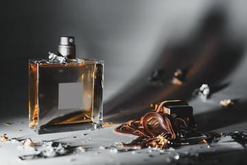 stylish bottle of perfume with gold accessories