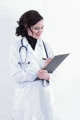 female doctor making notes in the medical record.