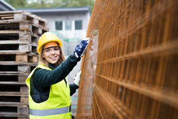 Young woman worker in an industrial area.