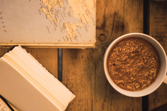Cacao on table with books