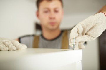 Macro of putting screw in furniture