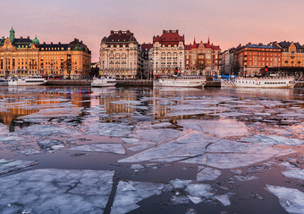 Winter image from Stockholm city with old boats and buildings. - 183767445