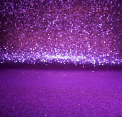 Purple glitter lights christmas bokeh background. defocused