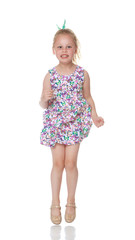 Little girl is jumping.