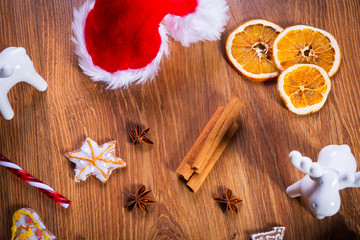 Christmas spices, gingerbread cookies and decorations on wooden table