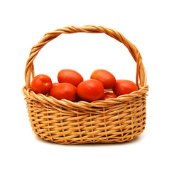 Fresh tomatoes in basket isolated on white