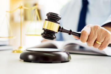 gavel and soundblock of justice law and lawyer working on wooden desk background.