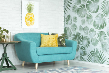 Turquoise couch in sitting room