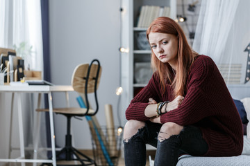 Sad young girl during maturation