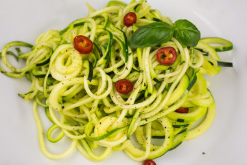vegetarian zucchini noodles with cherry tomatoes and pepper