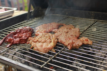 Grilled on a grill with white smoke. For party