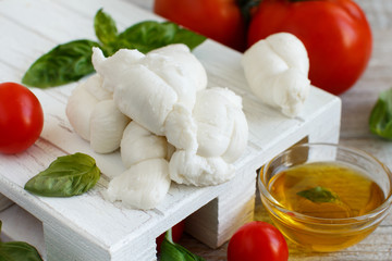 Italian cheese mozzarella nodini with tomatoes and herbs