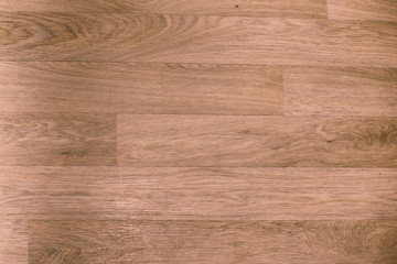 Dark wood texture background in wallnut color. . Wood laminate floor varnish decorated in home modern style.