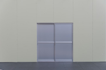 sidewalk by street wall & door