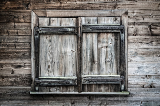 Old wooden window shutters closed