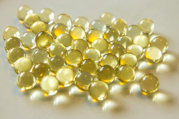 yellow liquid filled pills capsules. medicine pharmacy concept,