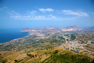 Fototapeta premium Sicily, Italy. Picturesque landscape of the sea coast. On the right is the town of Valderice