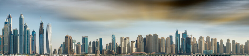 Fototapeta premium Aerial view of Dubai skyline at sunset