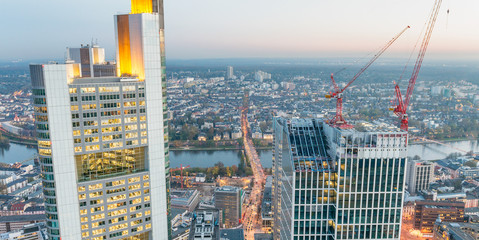 Aerial view of metropolis skyline at dusk, business concept