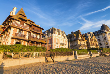 Deauville beach in Normandy, France at sunset - obrazy, fototapety, plakaty