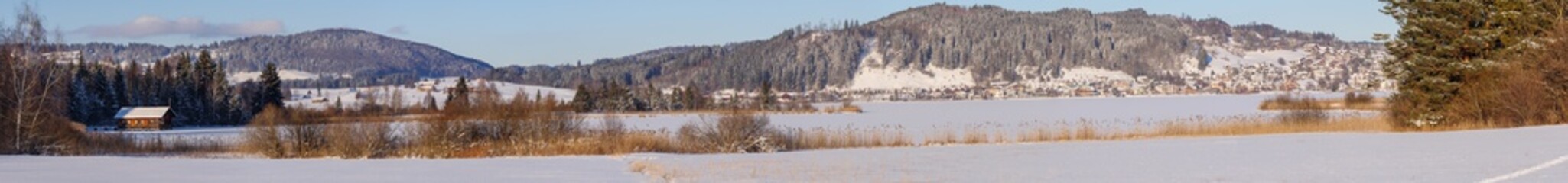 winter lake with mountains and snow