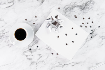 present and a cup of coffee on a marble background
